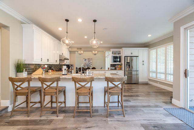 white kitchen with four chairs